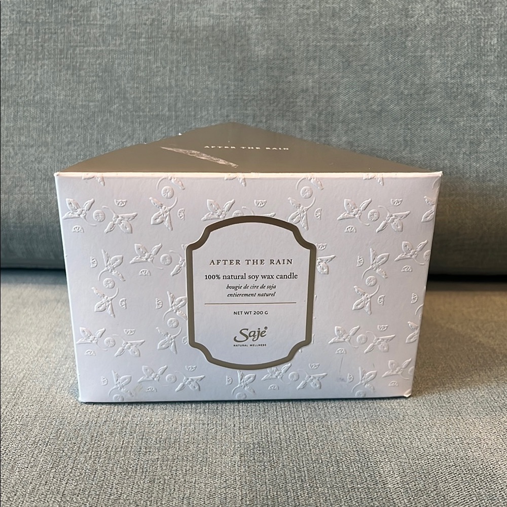 Saje White Bath & Body Product with Elegant Embossed Design